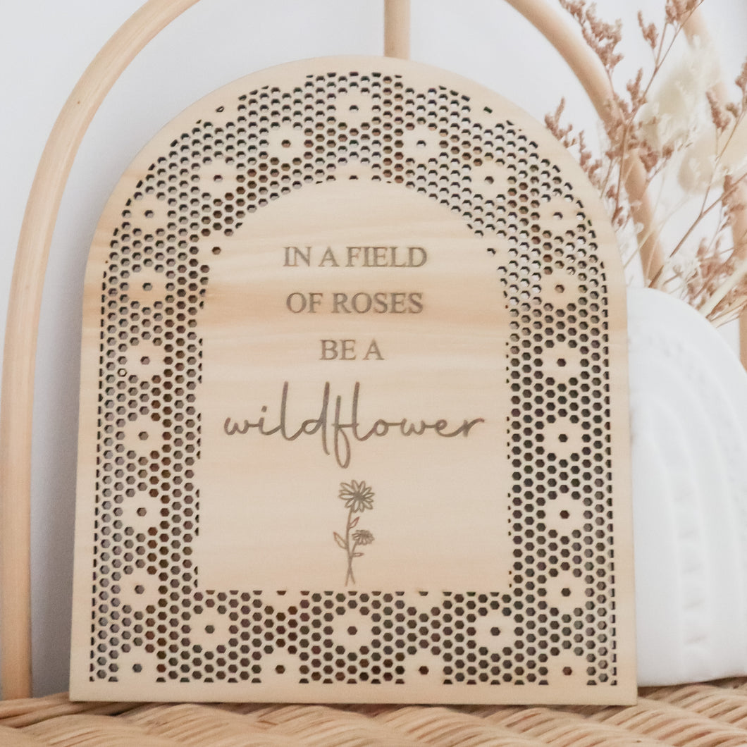 In a field of roses be a wildflower rattan flower plaque